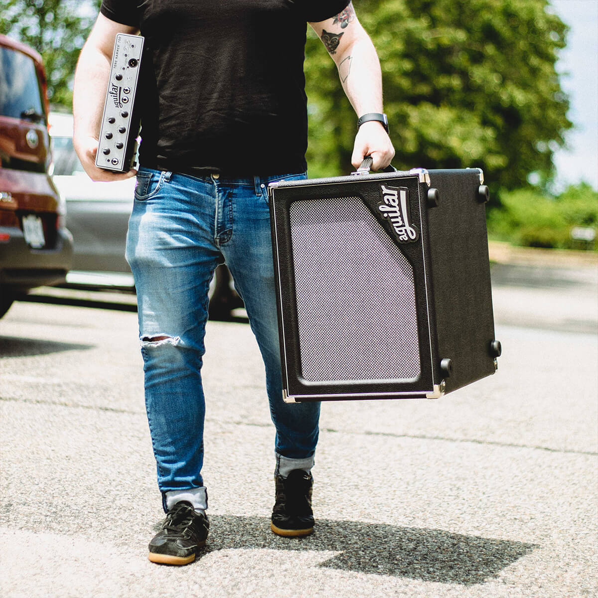 Man carrying Aguilar Cabinets